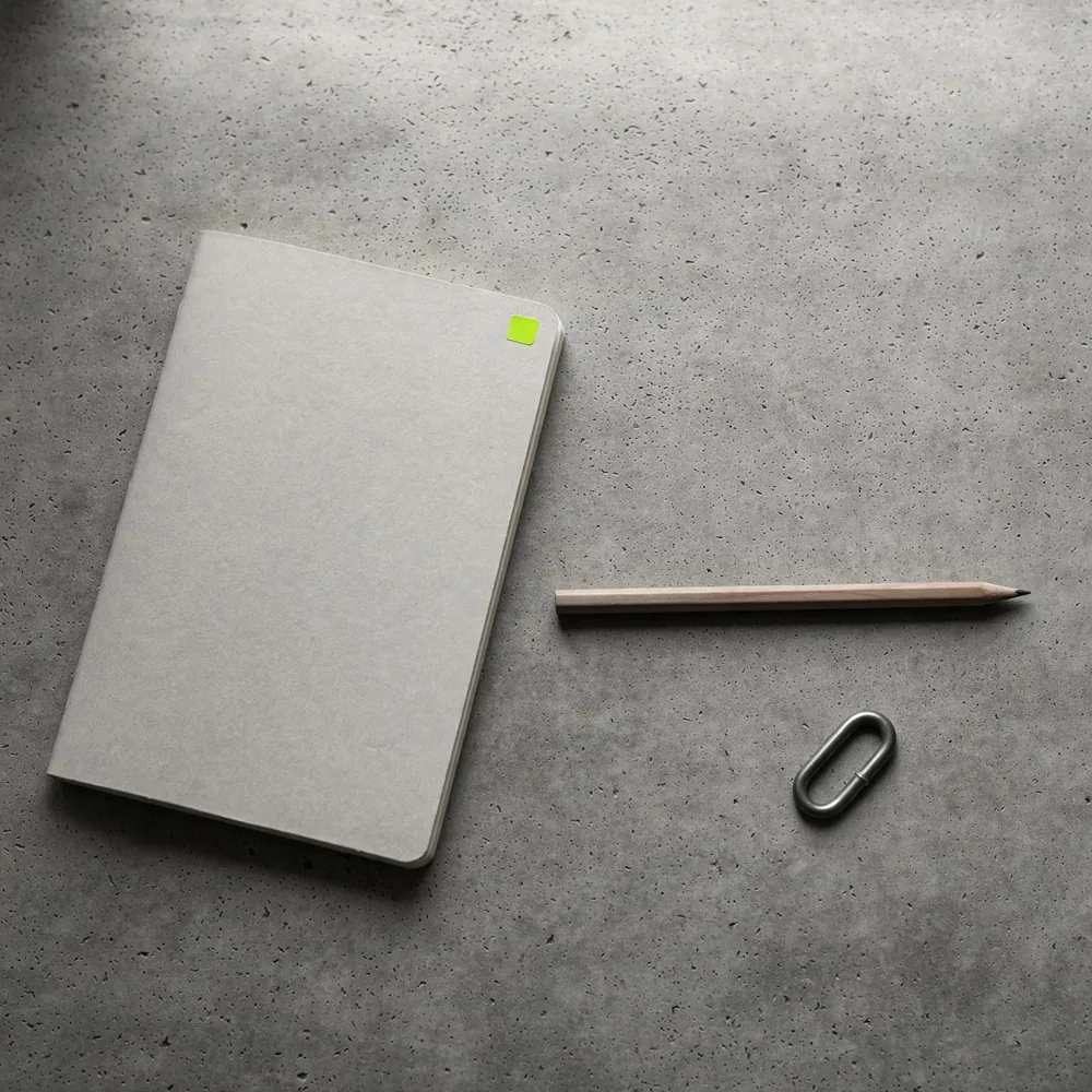 A notebook beside a chain link